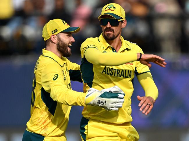 Mitch Starc celebrates one of his catches. Picture: Arun Sankar.