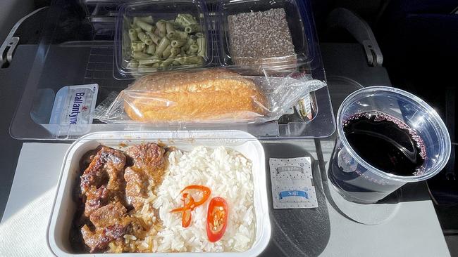 The plane food is shovelled down for sustenance. Picture: Toby Zerna