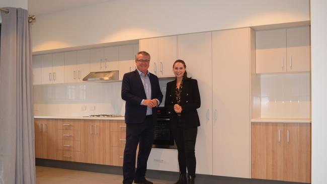 Mundingburra MP Les Walker and Housing Minister Meaghan Scanlon explore the inside of one of the 18 new social housing units.