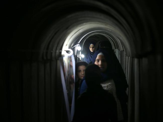 Palestinians tour a tunnel underneath Gaza. Picture: Mohammed Abed/AFP