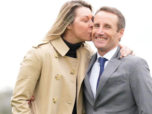Damien Oliver is kissed by his wife Trish Oliver during a Damien Oliver Media Call where he announced he will retire in December at Ladbrokes Park Hillside Racecourse on August 30, 2023 in Springvale, Australia. (Photo by Scott Barbour/Racing Photos via Getty Images)