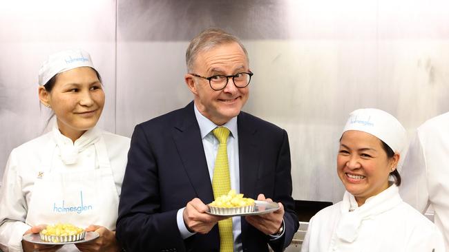 Labor leader Anthony Albanese poses a cheeky grin during a visit to a TAFE in the seat of Chisholm, Victoria. Picture: Liam Kidston