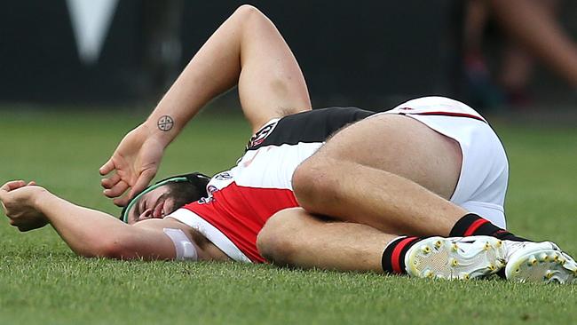 Paddy McCartin hits the turf after copping a knock to the head. Picture: Michael Klein