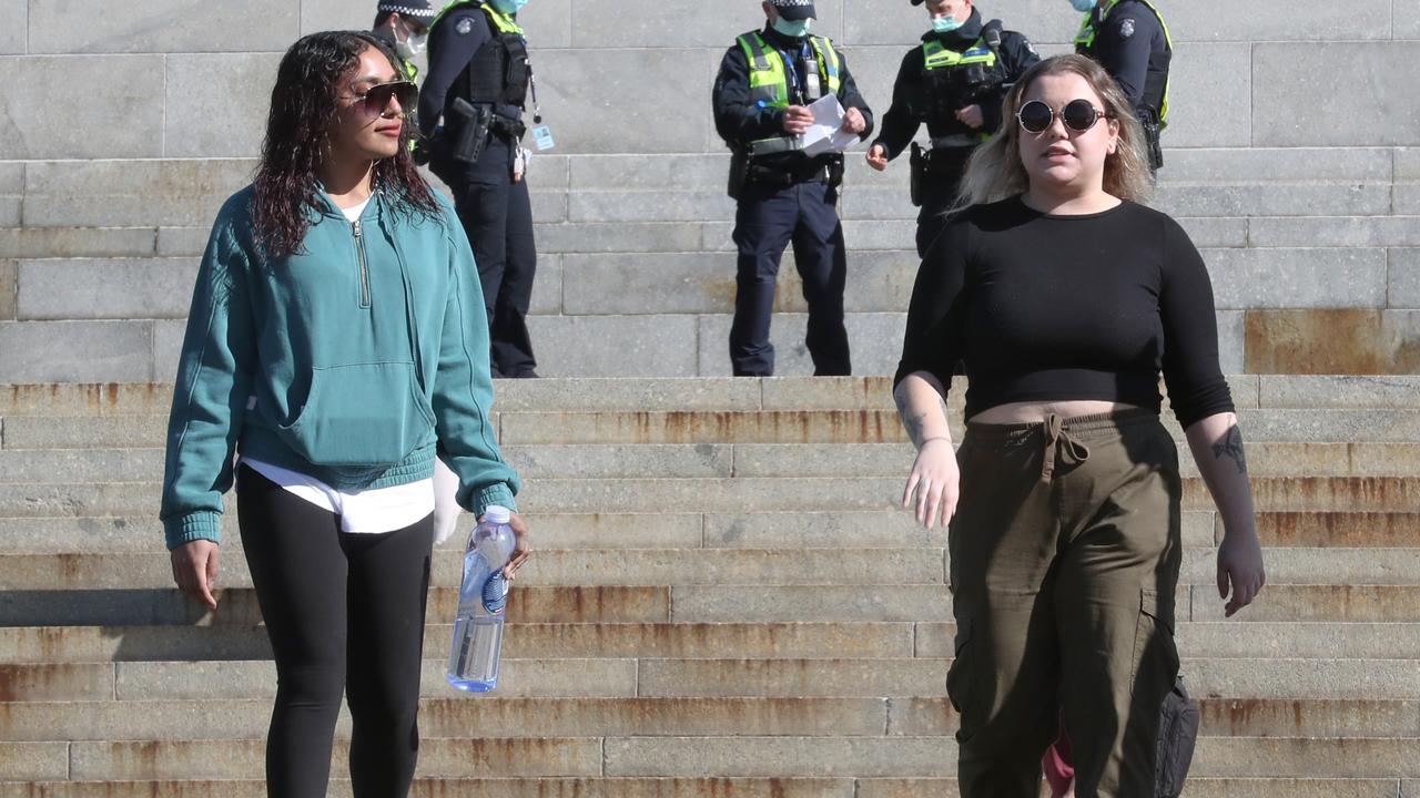 Two women fined at the scene for failing to wear masks. Picture: David Crosling / NCA NewsWire