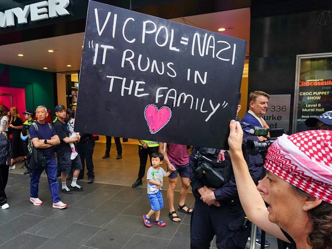 Pro-Palestinian protestors are seen along Bourke St Mall after Myer opened its much-loved Christmas windows display. Picture: NewsWire / Luis Enrique Ascui