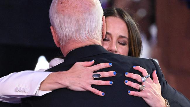 Joe Biden hugs his daughter, Ashley Biden, on stage. Picture: Saul Loeb/AFP