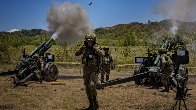 Philippine troops fire 105mm Howitzers during a live-fire exercise as part joint drills with US forces in Laur. Picture: Getty Images.