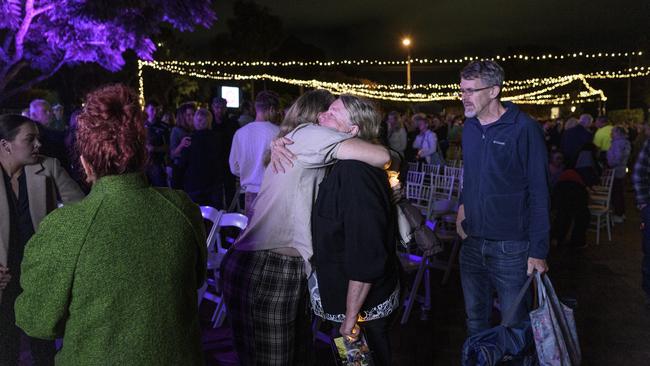 A family member of Frances Crawford is embraced after the Protea Place candlelight vigil to mark Domestic and Family Violence Prevention Month at Gips Restaurant, Tuesday, May 13, 2025. Picture: Kevin Farmer
