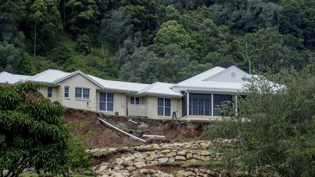 A house at Crest Hill Drive in Wongawallan beside a landslip due to heavy rainfall. Residents in surrounding houses have been asked to evacuate the area due to the risk of the property falling down the hill. Picture: Jerad Williams