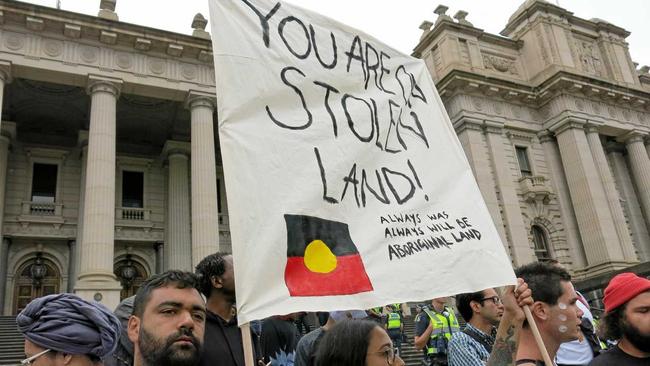 People attend an Invasion Day protest march in Melbourne. Picture: ALEX MURRAY