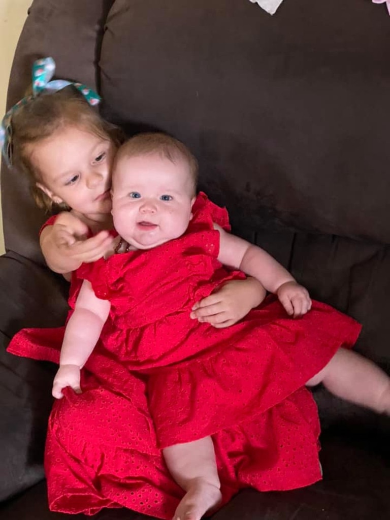 Ella Girdler's first Chrsitmas, celebrated with her big sister.