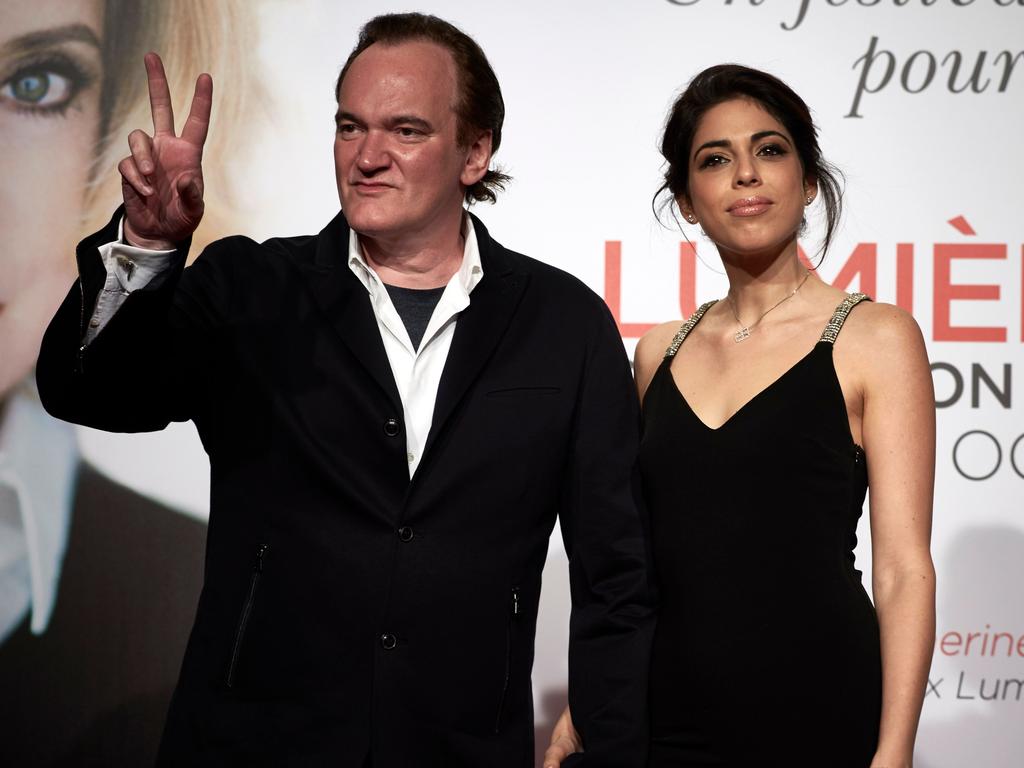 Quentin Tarantino (L) gestures as he poses with his partner Israeli singer Daniella Pick (R). Picture: AFP