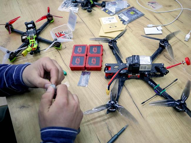 A Ukrainian activist works on a drone in western Lviv at a secret location in the city. Picture: Aleksey Filippov/AFP