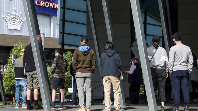 People outside the Melbourne Convention Centre Covid-19 vaccination hub. Picture: NCA NewsWire / Ian Currie