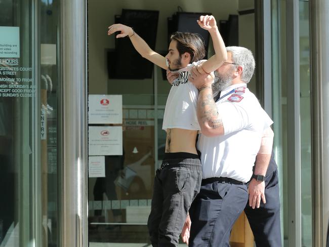 Extinction Rebellion spokesman and environmental activist Eric Herbert protesting outside the arrest court on July 11.