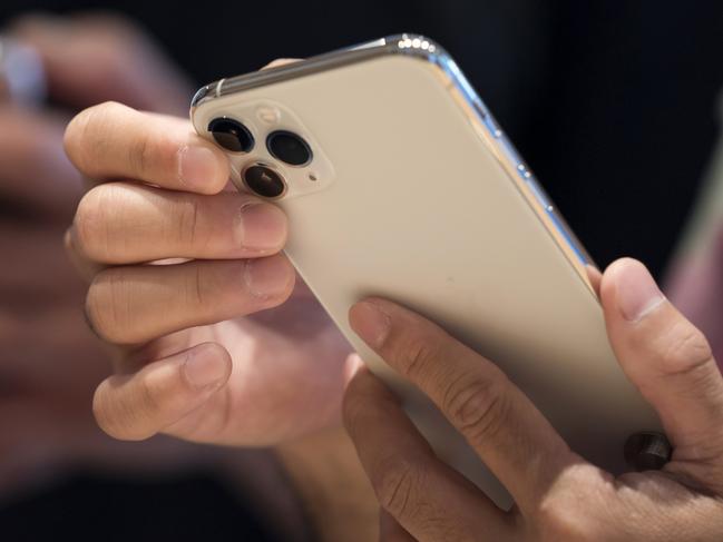 TOKYO, JAPAN - SEPTEMBER 20: A customer tries an iPhone 11 Pro Max in the Apple Marunouchi store on September 20, 2019 in Tokyo, Japan. Apple Inc. launched the latest iPhone 11 models featuring a dual-camera system today.  (Photo by Tomohiro Ohsumi/Getty Images)