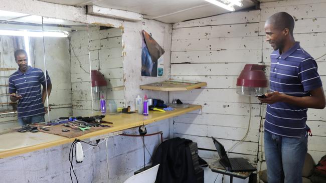 Inside a barber shop, which has no floor and a roof that’s caving in, in Langa. Picture: Megan Palin.