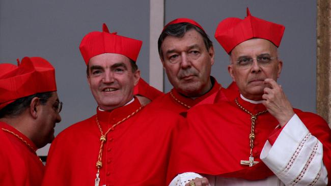 George Pell looks out from a balcony during the first public appearance of Pope Benedict XVI from the St. Peter's Basilica at the Vatican in 2005. Picture: AP Photo/Gregorio Borgia