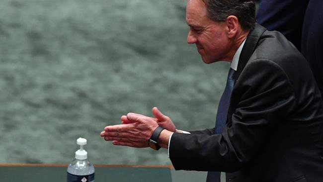 Minister for Health Greg Hunt uses Anti-Bacterial gel following Question Time in the House of Representatives at Parliament House on Wednesday. Picture: Sam Mooy/Getty Images