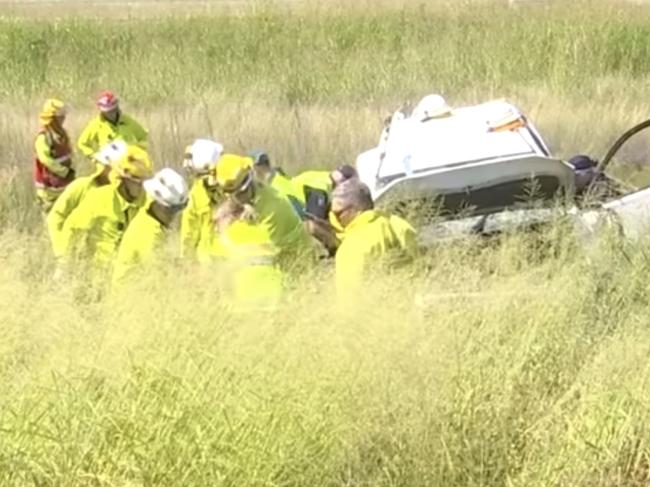 A young woman and a toddler have escaped major injury after their vehicle rolled into a ditch  off the Warrego Highway. Photo: 7 News