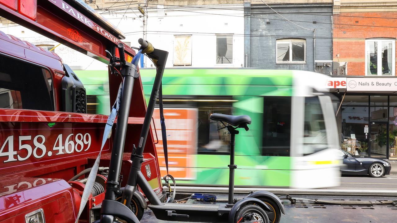 Two confiscated privately owned E-Scooters sit on the back of a tow truck in Sydney Road Brunswick, due to their speed they are illegal to be ridden outside of a person’s private property. Picture NCA NewsWire / Ian Currie