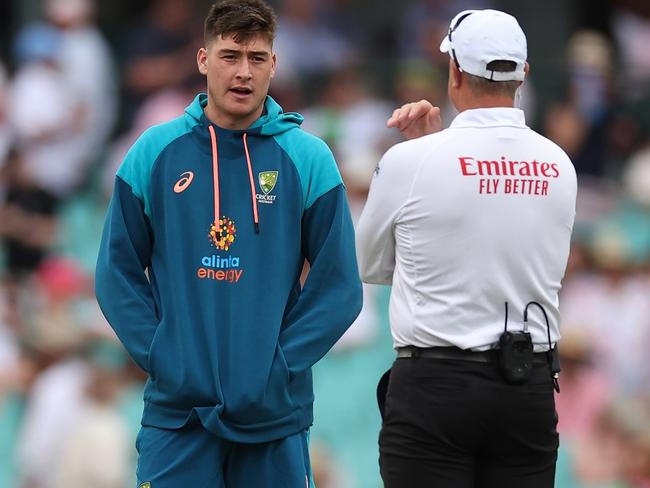 SYDNEY, AUSTRALIA - JANUARY 04: Matt Renshaw of Australia speaks with the umpire as play is suspended due to bad light during day one of the Third Test match in the series between Australia and South Africa at Sydney Cricket Ground on January 04, 2023 in Sydney, Australia. (Photo by Cameron Spencer/Getty Images)