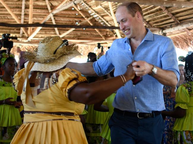 Britain's Prince William dances with a Garifuna women at Hopkins Village, Belize. Picture: AFP