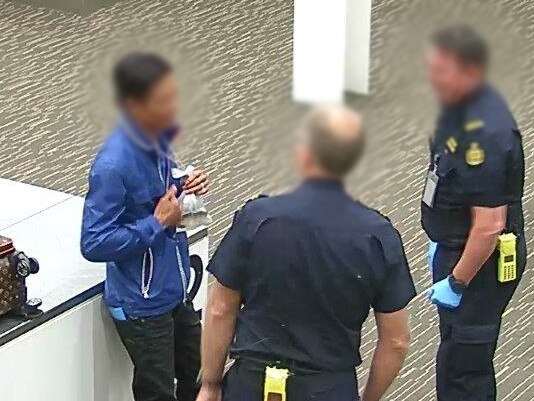 Van Ho Le talks to Border Force officers after the fish was found. Picture: Australian Border Force