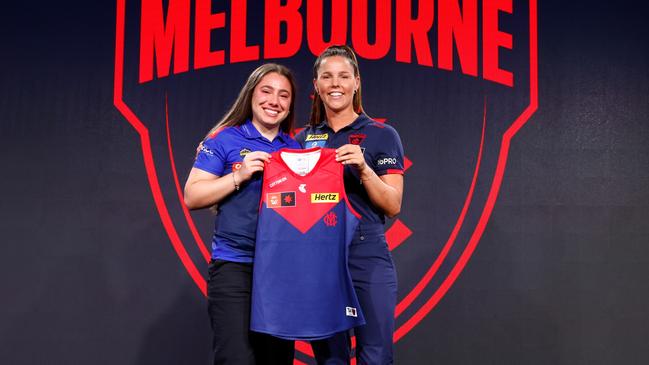 An emotional Alyssia Pisano on stage with new skipper Kate Hore. Picture: Dylan Burns/AFL Photos