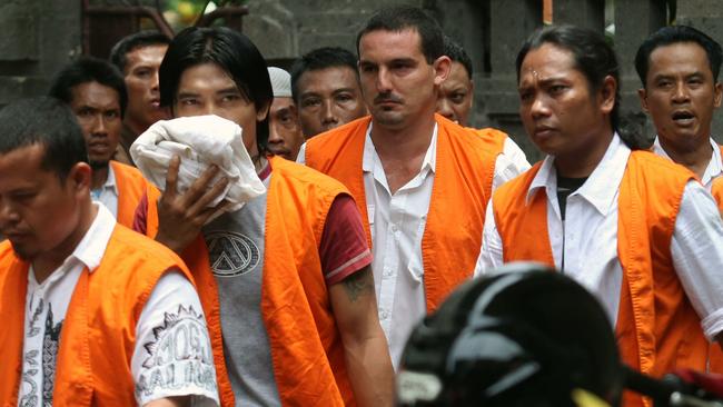 Graeme Michael Pollock (C) among other detainees arrives at Denpasar District court for his verdict, Wednesday, February 29, 2012.