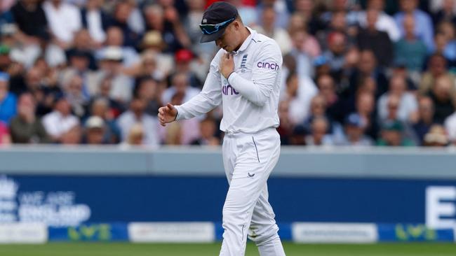 Ollie Pope injured his shoulder after returning to the field. Picture: AFP Images