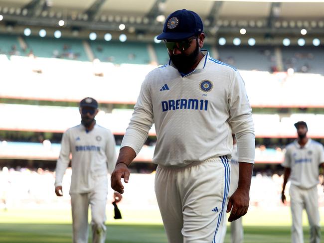 India's Rohit Sharma leaves the field at the close of play on day four of the fourth cricket Test match between Australia and India at the Melbourne Cricket Ground (MCG) in Melbourne on December 29, 2024. (Photo by Martin KEEP / AFP) / -- IMAGE RESTRICTED TO EDITORIAL USE - STRICTLY NO COMMERCIAL USE --