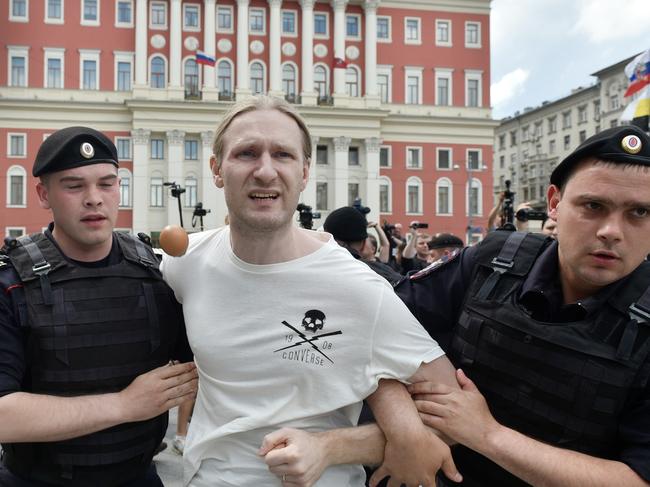 CREDIT: GETTYOMLINE USE ONLYMOSCOW, RUSSIA - MAY 30: Russian riot policemen detain lesbian and LGBT rights activist during an unauthorized gay rights activists rally on May 30, 2015 in Moscow, Russia. (Photo by Gleb Schelkunov/Kommersant Photo via Getty Images)