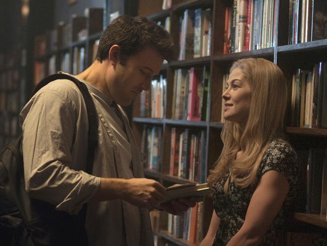 Ben Affleck, left, and Rosamund Pike appear in a scene from Gone Girl.