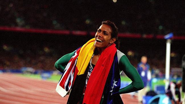 Cathy Freeman after winning gold in the 400m final at the 2000 Olympic Games in Sydney. Picture: Nick Wilson/Allsport