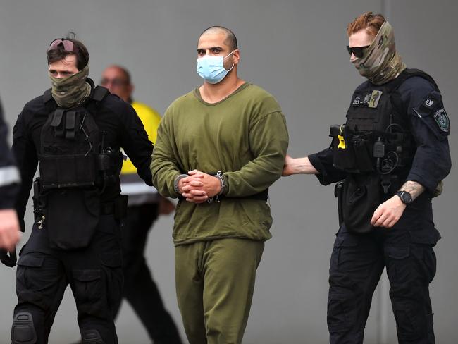 COOLANGATTA, AUSTRALIA - NewsWire Photos NOVEMBER 11, 2021: Alleged drug smuggler Mostafa Baluch seen boarding a NSW Police plane at Coolangatta Airport as he's extradited to NSW from Queensland after being arrested on the NSW/QLD border following a frantic two week manhunt. Picture: NCA NewsWire / Dan Peled