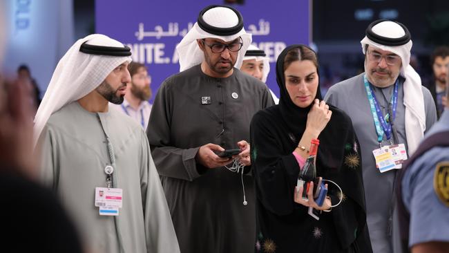 COP28 president Sultan Ahmed Al Jaber, centre, emerges from negotiations on day 11. Picture: Getty Images