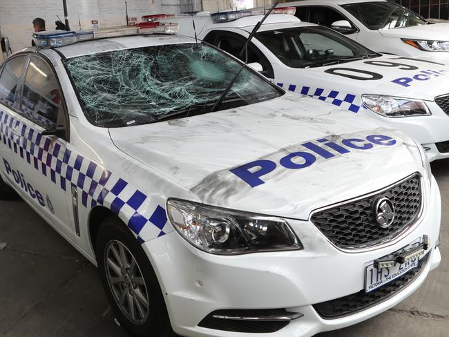 The damaged police car. Picture: David Crosling