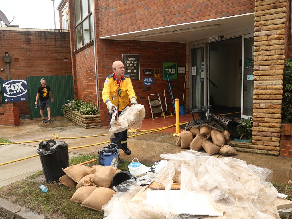 Camden a day after another flood in the area in two weeks . The Camden sports club and Bowling club flooded again after most repairs from the last flood were being completed.