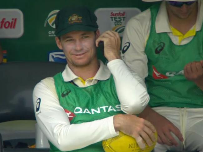 Peter Handscomb speaks to coach Darren Lehmann on a walkie talkie.