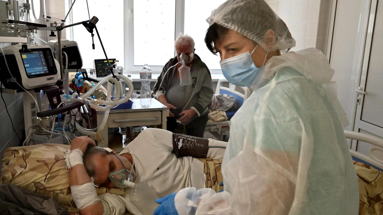 A Covid-19 patient is treated at an intensive care unit in a Kiev hospital as cases surge in the city. Picture: Sergei Supinsky/AFP