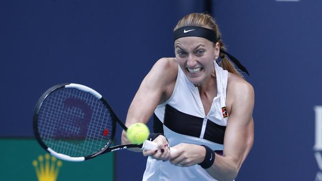 Petra Kvitova, of the Czech Republic, returns a volley to Caroline Garcia, of France, during the Miami Open tennis tournament, Monday, March 25, 2019, in Miami Gardens, Fla. (AP Photo/Joel Auerbach)