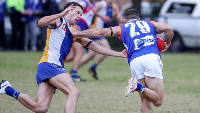 Brent Harvey gives Matt McGregor the Don’t Argue. Picture: George Salpigtidis