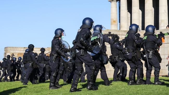 Riot police tackle a protest at the Shrine of Remembrance. Picture: Ian Currie