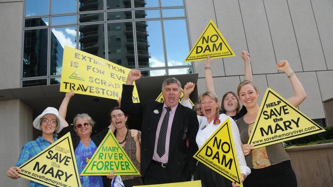 David Kreutz and Glenda Pickersgill with supporters celebrate at the Federal Court in Brisbane.