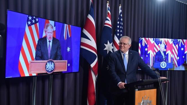 Britain’s Prime Minister Boris Johnson with Scott Morrison and US President Joe Biden at the AUKUS announcement.