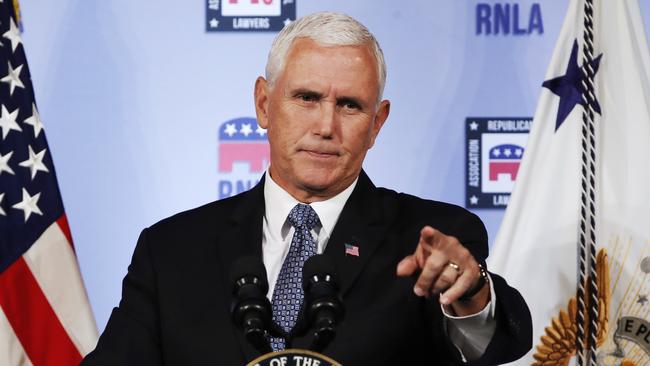 FILE - In this Aug. 24, 2018 file photo, Vice President Mike Pence gestures while speaking to the Republican National Lawyers Association in Washington. President Donald Trump is lashing out against the anonymous senior official who wrote an opinion piece in The New York Times.  Washington is consumed by a wild guessing game as to the identity of the writer, and swift denials of involvement in the op-ed came Thursday from top administration officials, including from Vice President Mike Pence's office, Secretary of State Mike Pompeo and Dan Coats, director of national intelligence, and other Cabinet members.  (AP Photo/Jacquelyn Martin)