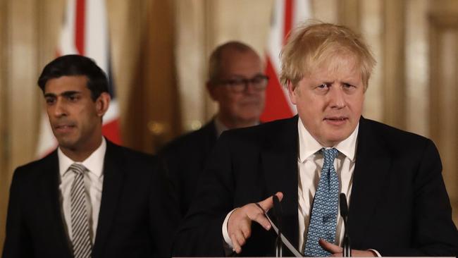 Britain's Chancellor Rishi Sunak, Prime Minister Boris Johnson and Chief scientific officer Patrick Vallance arrive for a press conference about the ongoing situation with the coronavirus (COVID-19) outbreak inside 10 Downing Street.