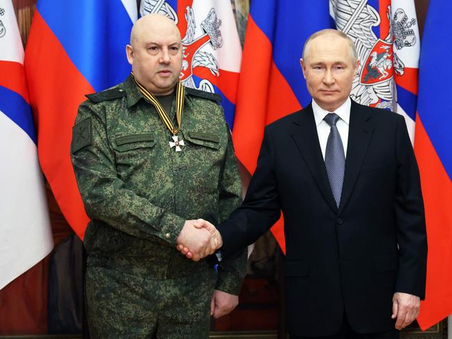 Vladimir Putin with the former commander of Russia's military operation in Ukraine, General Sergei Surovikin. Picture: AFP