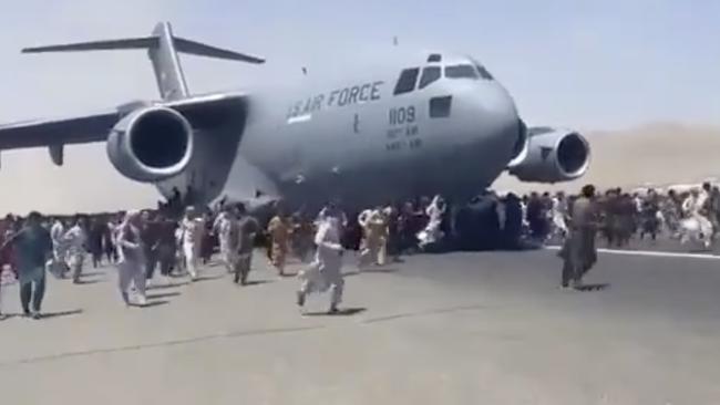 People surround the plane on the tarmac before it took off.